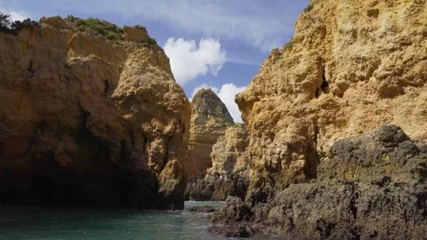 View through a gap in cliff formation from a boat Video stock 273675676