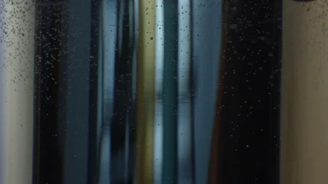 View Through a Glass with Carbonation Stock Footage 76426989