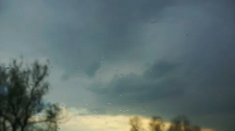 View through the glass with rain drops on the nature. Video stock 37396055