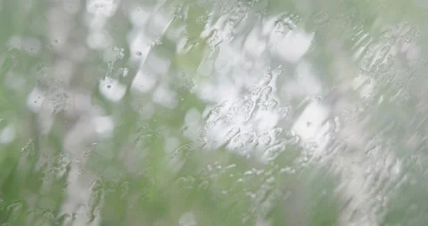 View through a glass on which raindrops fall. Stock Footage 132271379