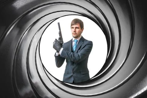View through gun barrel on agent with pistol. Stock Photos
