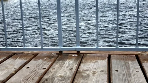 View through the iron railing at sea wave. Stunning landscape on ocean.  Move  Stock-Footage 116806978