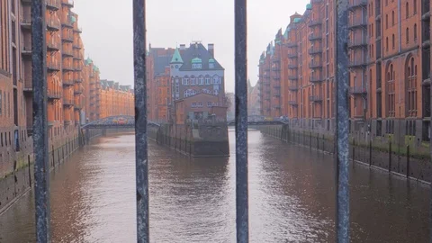 View through the lattice on famous channel in old warehouse district, Hamburg Stockbeeldmateriaal 100557730
