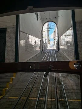View through a Lisbon funicular toward a steep railway tunnel Stock-Fotos