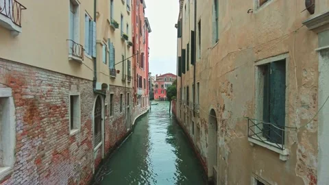 View through a narrow canal with old buildings in Venice, Italy. Stock Footage 161960010