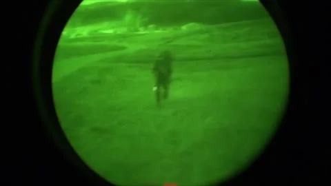 View through night vision in a mission operation.Subdivision army anti terrorist Stock Footage 139477264