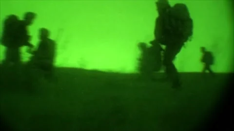 View through night vision in a mission operation.Subdivision army anti terrorist Stock Footage 139477309