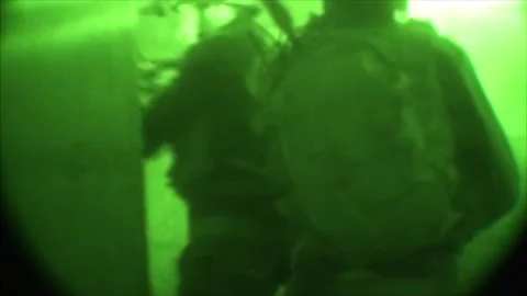 View through night vision in a mission operation.Subdivision army anti terrorist Stock Footage 139477338
