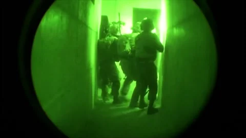 View through night vision in a mission operation.Subdivision army anti terrorist Stock Footage