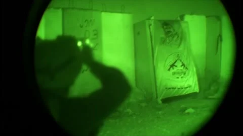 View through night vision in a mission operation.Subdivision army anti terrorist Stock Footage 139477383