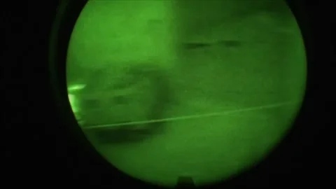View through night vision in a mission operation.Subdivision army anti terrorist Stock Footage 139477388