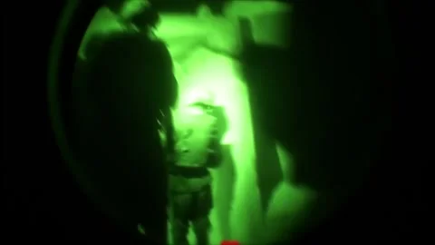 View through night vision in a mission operation.Subdivision army anti terrorist Stock Footage 139477398