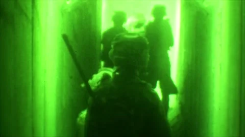 View through night vision in a mission operation.Subdivision army anti terrorist Stock Footage 139477404