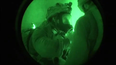 View through night vision in a mission operation.Subdivision army anti terrorist Stock Footage 139477415