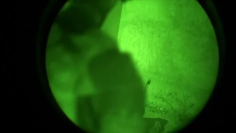 View through night vision in a mission operation.Subdivision army anti terrorist Stock Footage 139477433