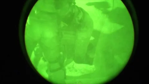 View through night vision in a mission operation.Subdivision army anti terrorist Stock Footage 139477441