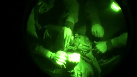 View through night vision in a mission operation.Subdivision army anti terrorist Stock Footage 139477444