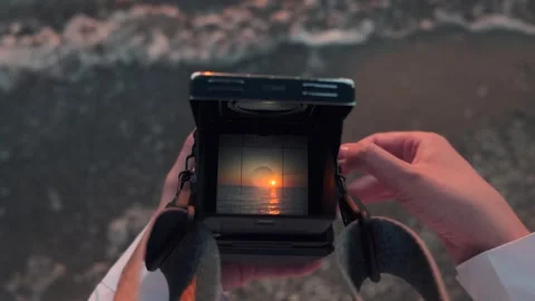 View through old film camera viewfinder. Female hands holding retro analogue tlr Stock Footage 254425958