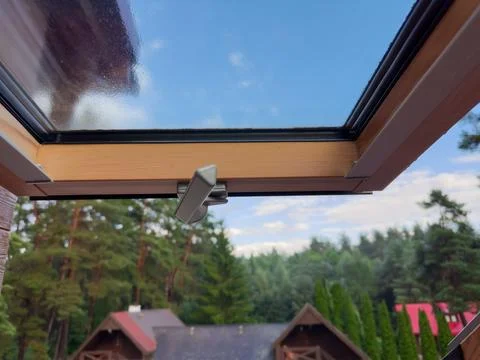 View through the open roof window with handle on foreground Stock Photos