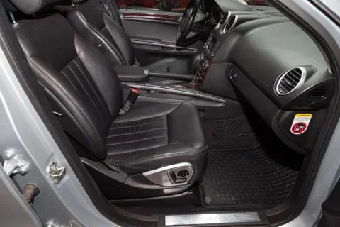 View through opened door to black interior of Mercedes Benz ML350 M class wit Stock Photos