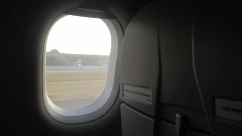 View through out the plane window of airplane while take off from the airport in Stock Footage 289812537