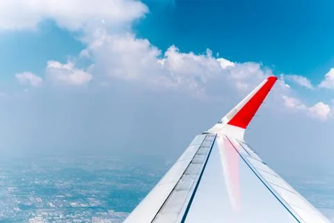 View through plane window with cloud and sky. Stock Photos