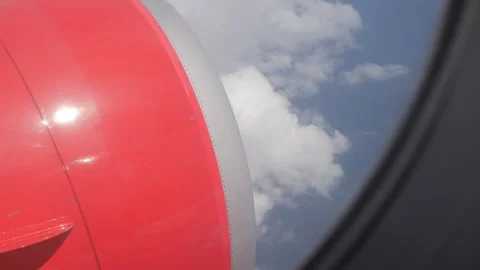 View through plane window looking down with view of aeroplane's engine whil.. Stock-Footage 296090026