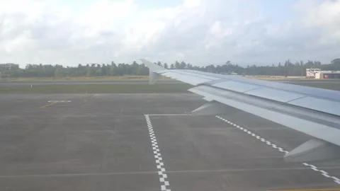 View through plane window while aircraft taxiing on the taxi way to the run.. Stock Footage 309000479
