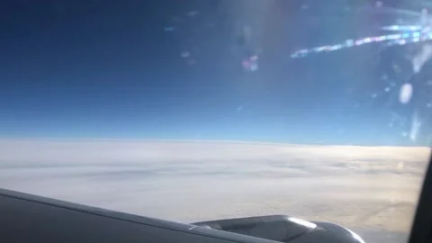 View through the porthole on the wing and clouds. Airplane wing through the Video stock 201153084