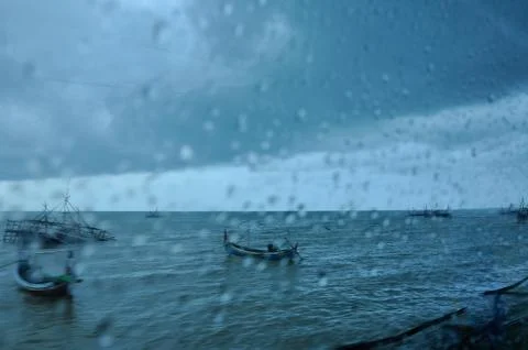 View Through A Rainy Window the sea with fishing boats 스톡 사진