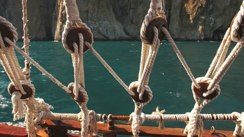 View Through Ropes of Ship at Sea Stock Footage