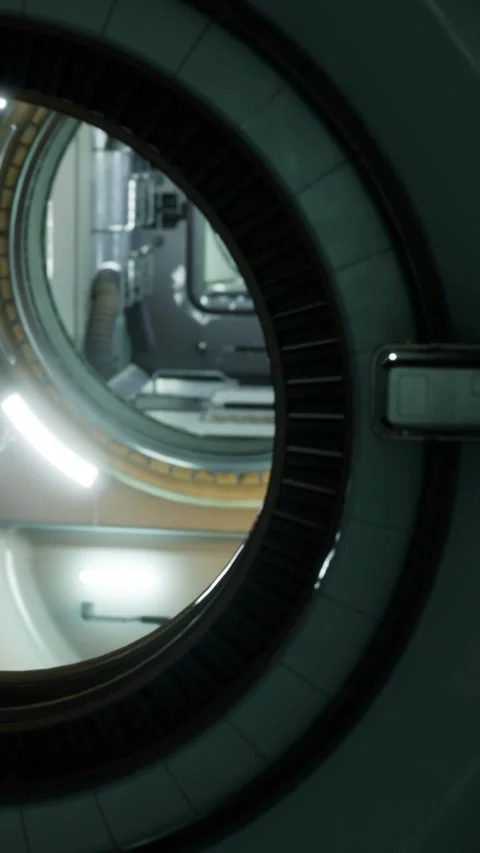 View through a round opening showing a futuristic room and equipment Stock Footage 334184851
