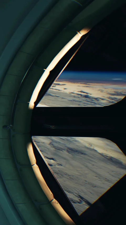 View through a round window looking at the ocean and a ship far away Stock Footage 344959262