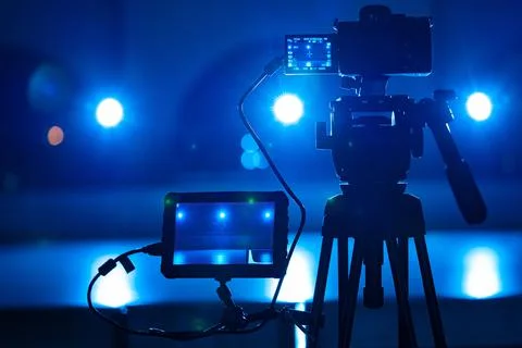 View through screen of video camera on ice arena in blue light. Process of Stock Photos
