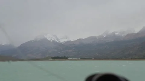 View through ship bridge windshield across Lago Argentino in Patagonia Stock Footage 336752360