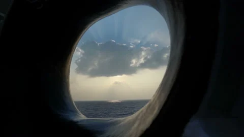 View through ship's clew. Cloud in rays of sun and sea. Stock Footage 195834674