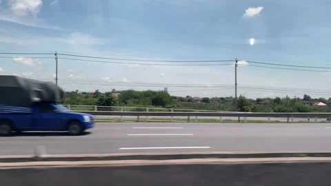 View through the side window of moving car on the road. Stock Footage 201388815