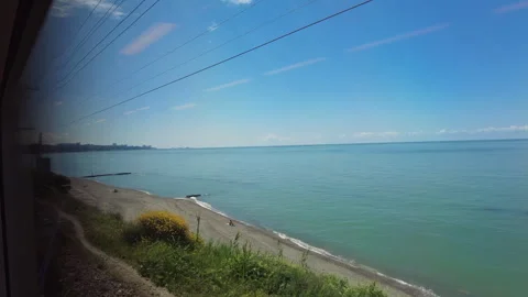 View through the train window to the Black Sea shore near the city of Sochi. Stock Footage 250695305