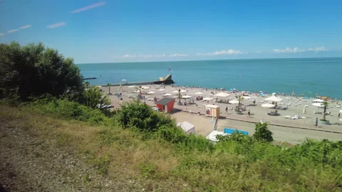 View through the train window to the Black Sea shore near the city of Sochi. Stock Footage 250698024