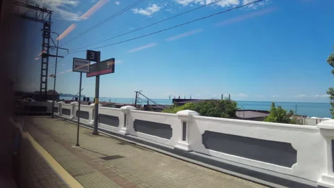 View through the train window to the Black Sea shore near the city of Sochi. Stock Footage 250698131