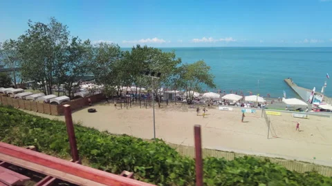 View through the train window to the Black Sea shore near the city of Sochi. Stock Footage 250698307