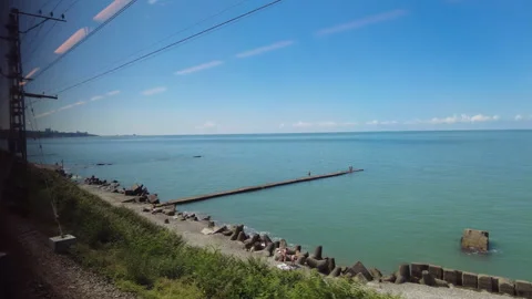 View through the train window to the Black Sea shore near the city of Sochi. Stock Footage 250701479