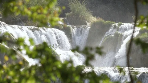 A view through the trees on the famous waterfalls of Krka Stock-Footage 118975304