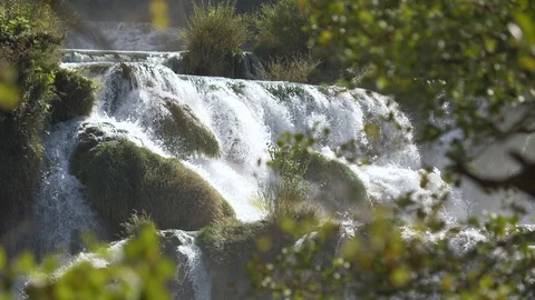 A view through the trees on the famous waterfalls of Krka Video stock 118975377