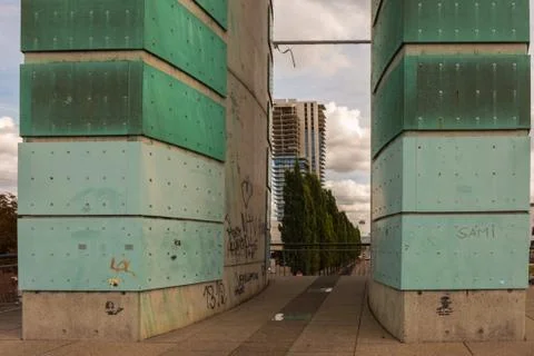 The view through two big pipes to an unfinished apartment tower Stock Photos