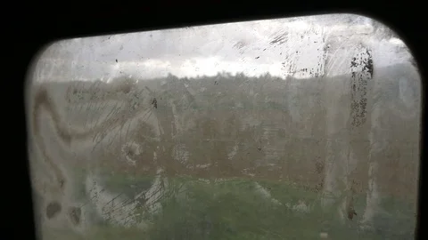 View Through A Very Dirty Window Of A Riding Train Stock Footage 114254104