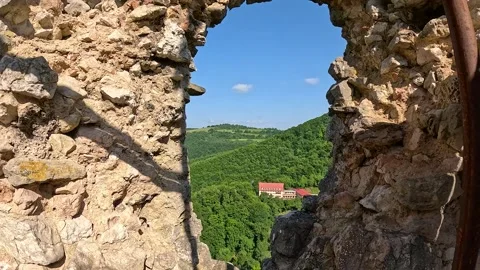 View Through Vrsatec Castle Ruins Over Green Landscape Stock Footage 342112711