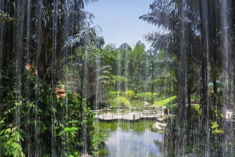 View through the waterfall pond Stock Photos