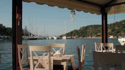 View through waterside taverna of the harbour at little port vathi Stock Footage 12343032