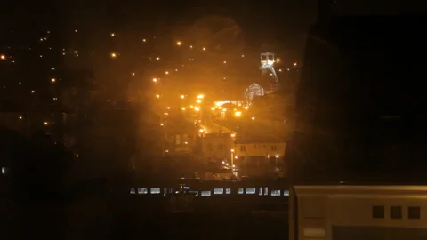 View Through Wet Glass: Train Departure From A Rainy City. Blurred Night Lights. Video stock 100384915